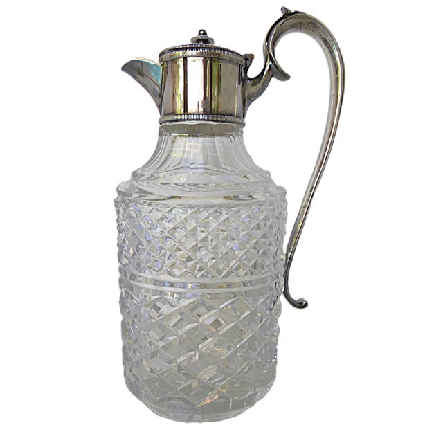 Lovely brilliant cut crystal decanter with silver plate handle and top. Masterful cut crystal possibly made by Waterford...