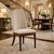 An elegant statement chair that brings refined warmth and sophistication to any dining room. This beautifully detailed...