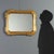 Cabaret mirror in gilt wood, dating back to the mid-19th century, crafted in Italy. The molded frame is embellished with...