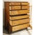 This piece features a classic colonial silhouette with a tall, balanced frame and gently curved feet. The eight‑drawer...