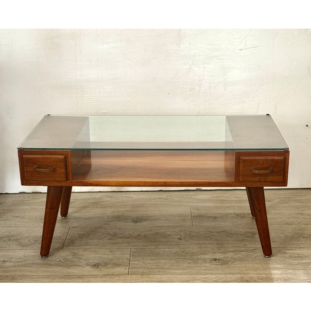 Stunning Vintage Mid Century Modern solid Wood Coffee Table Handcrafted in 1955. Features Glass Top, Two pull out drawers...