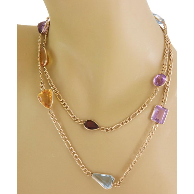 This beautiful long figaro link necklace is crafted from 14k yellow gold featuring double side 8 assorted shape and size...