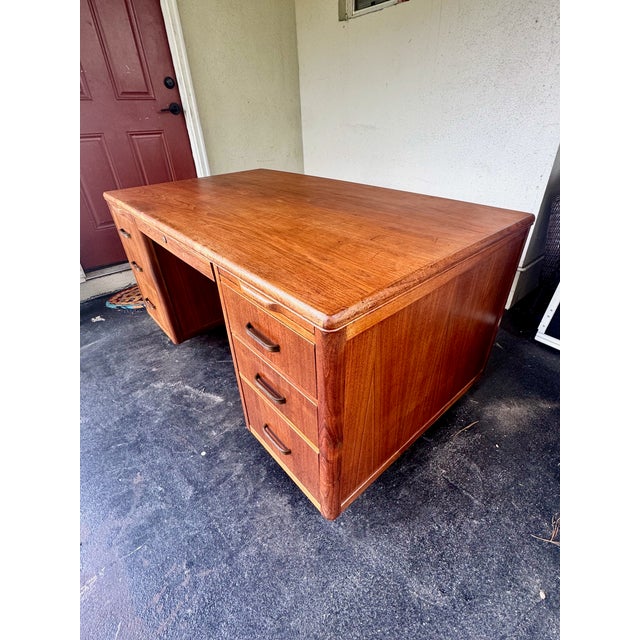 Mid-Century Modern walnut executive desk by Leopold Company in Burlington Iowa. Nominal measurements: 60" W x 34" D x...