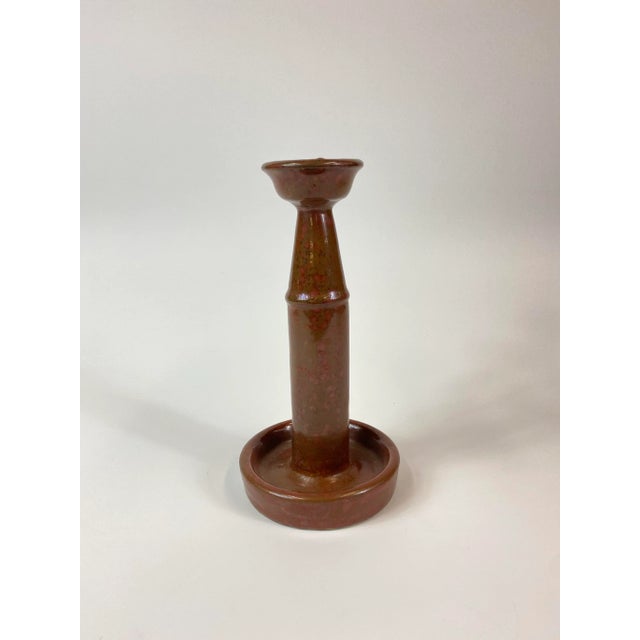 Unusual brown glazing with pink speckles. Oil and a wick was placed at the top and any excess would be caught in the...