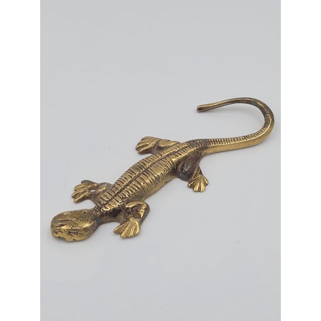 Add a touch of playful character to your entryway or mudroom with this vintage solid brass lizard wall hook. Crafted with...