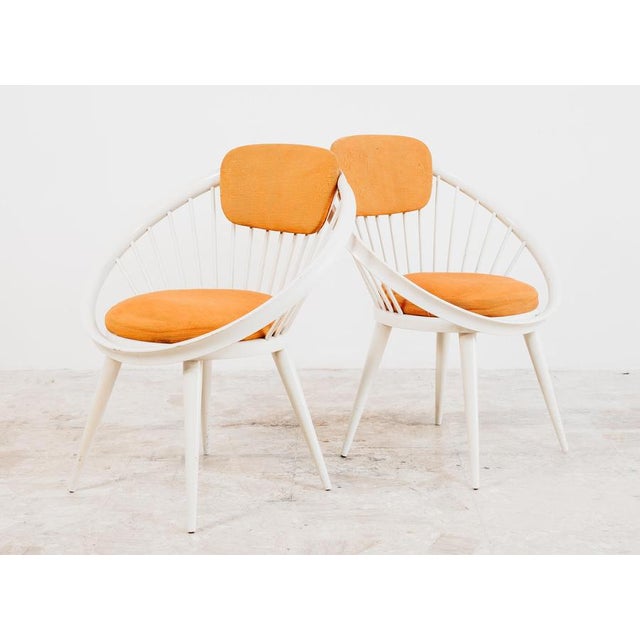 Pair of Circle model armchairs, with round solid beech wood frame painted white, round slatted seat, as well as the...