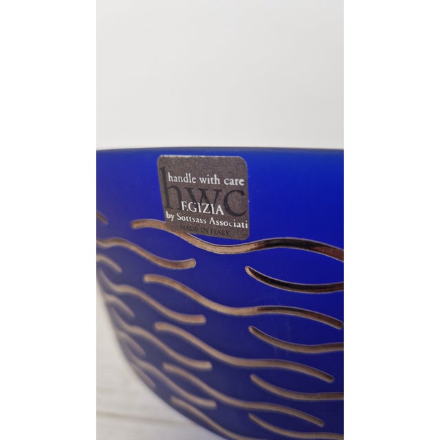 The vase is part of the "a collection of decorated glass egizia by sottsass associati" collection, "handle with care,"...