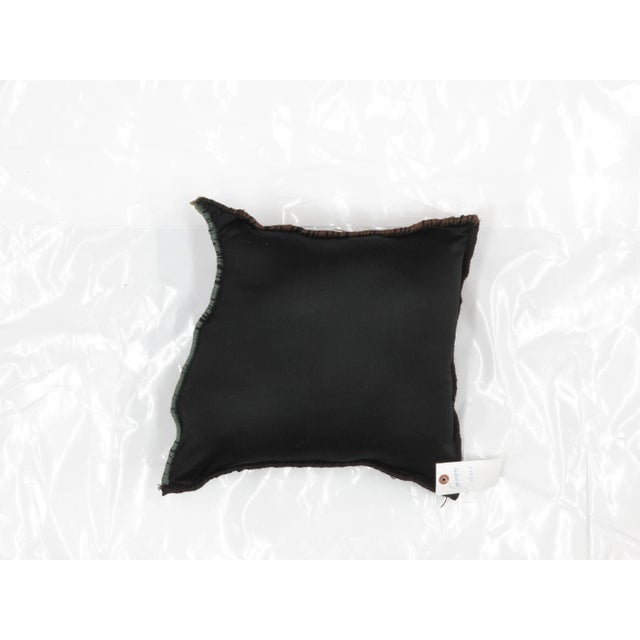 Pillow with genuine hand made antique Persian rug fragment.Poly fill, fabric backing with sewn closure.