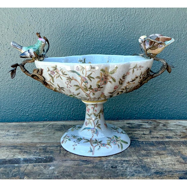 This exquisite vintage centerpiece bowl is a masterclass in French Chinoiserie elegance. The pedestal cachepot features a...