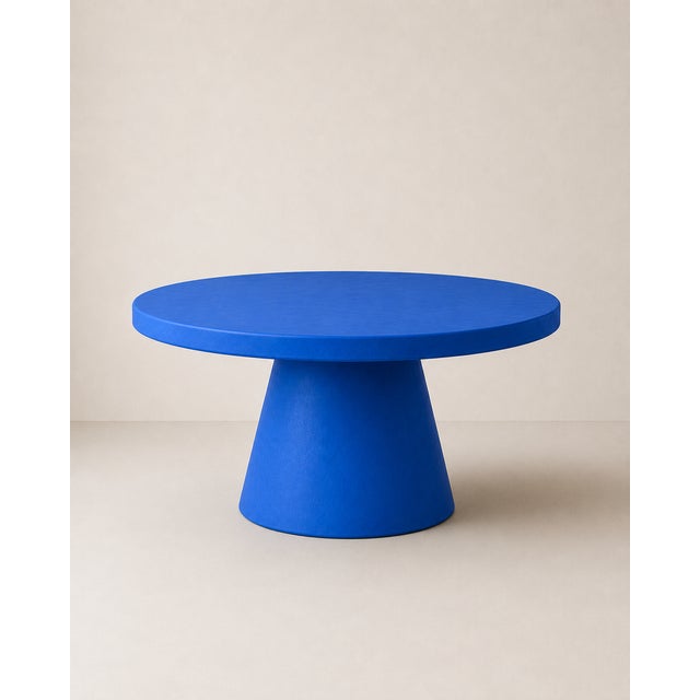 Round table in electric blue microcement, designed by Andrea Toffanin for Hood – Back & Forth Design. A sculptural and...