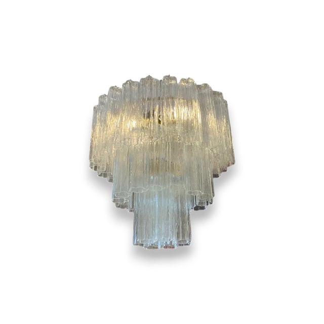 Murano glass ceiling lamp designed by Paolo Venini, from the 1980s. Composed of a circular structure of three levels,...