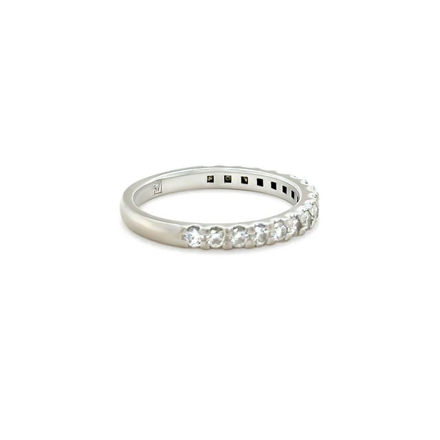 A refined 18ct white gold diamond wedding ring featuring a classic diamond-set band design. Elegant and timeless, the ring...