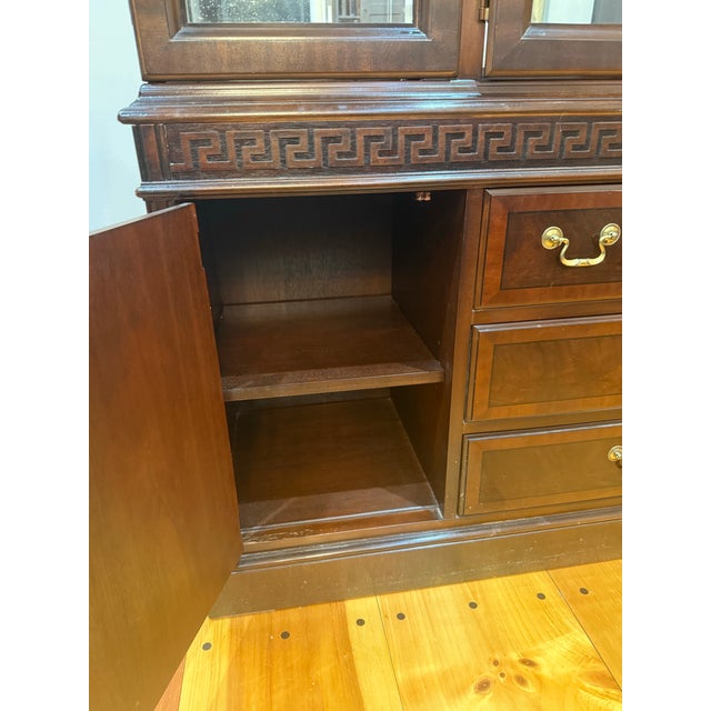 Original receipt available. A magnificent Chippendale by Drexel mahogany china cabinet in exceptional condition....