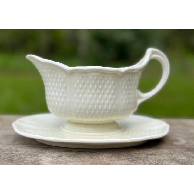 Elegant French Gien Pont Aux Choux creamware sauce boat with underplate. This beautiful piece of tableware is a work of...