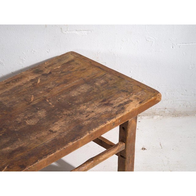 Antique low table in pine wood, traditional Chinese furniture originating from northern China and dated circa 1920....