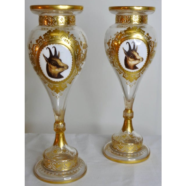 This is a stunning pair of Bohemian glass vases with animal vignettes painting on raised panels. One side depicting a...
