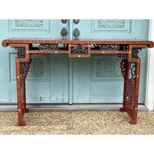 Delicately decorated rectangular table with a pierced frieze, on square legs. Vibrant colors and patterns that attractive...