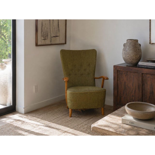 Danish Mid-Century Modern, Highback Lounge Chair, Elm, Wool, Denmark, 1950s An organic modern lounge chair designed and...