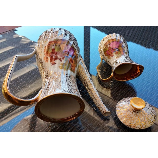 Early 20th century Fragonard teapot and milk jug, circa 1930, English and signed. In perfect condition, never used. Gold...