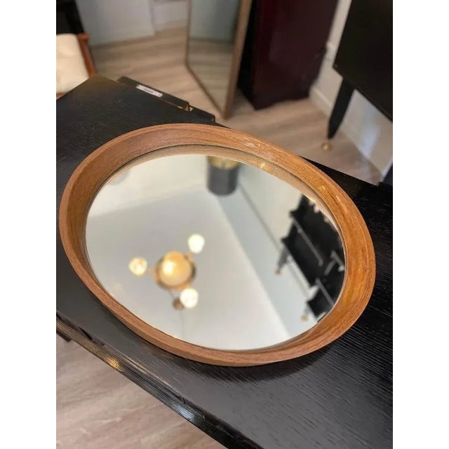 Elegant oval tray from the 1970s featuring a mirrored surface and a painted wooden rim. The base structure is also made of...