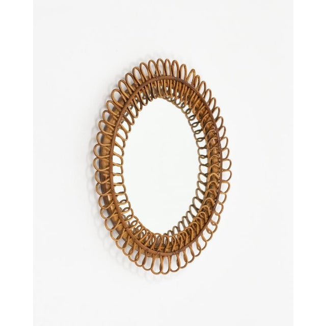 Mid-century beautiful round wall mirror with chain in bamboo and rattan in the style of Italian design Franco Albini. Made...