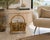 A beautifully handcrafted vintage bent bamboo and rattan magazine rack, featuring elegant curved lines, a sculptural...