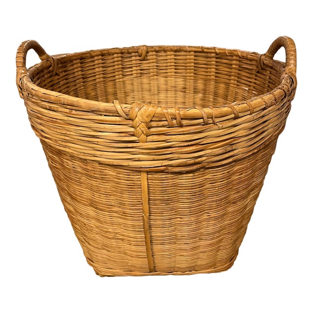 Mid 20th Century Round Tapered Woven Reed Basket Vintage Utility Laundry Basket With Reinforced Bottom and Wrapped Handles For Sale