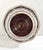A handsome vintage silverplate wine bottle coaster featuring a solid wood base and elegant pierced gallery with a classic...