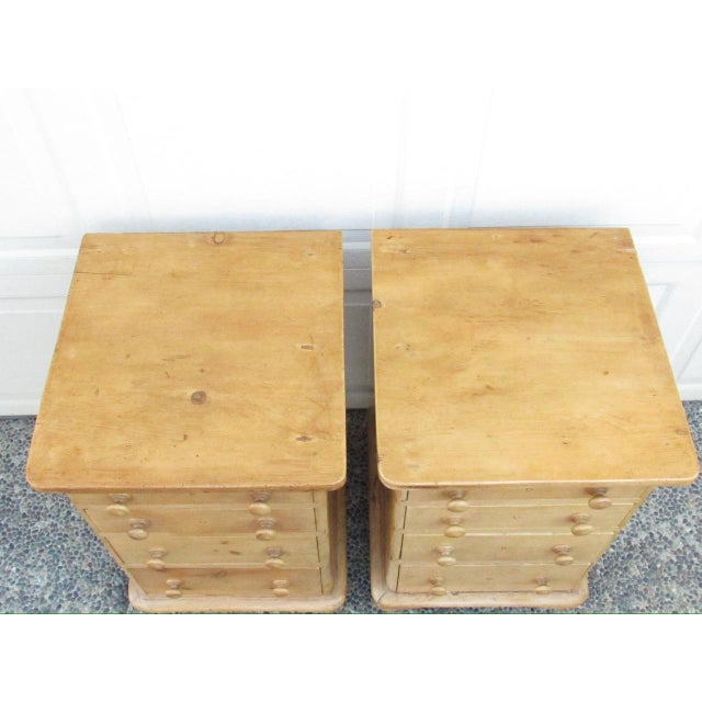 Antique English pine nightstands, c.1870 A good looking pair of pine nightstands with a rectangular top below which are...