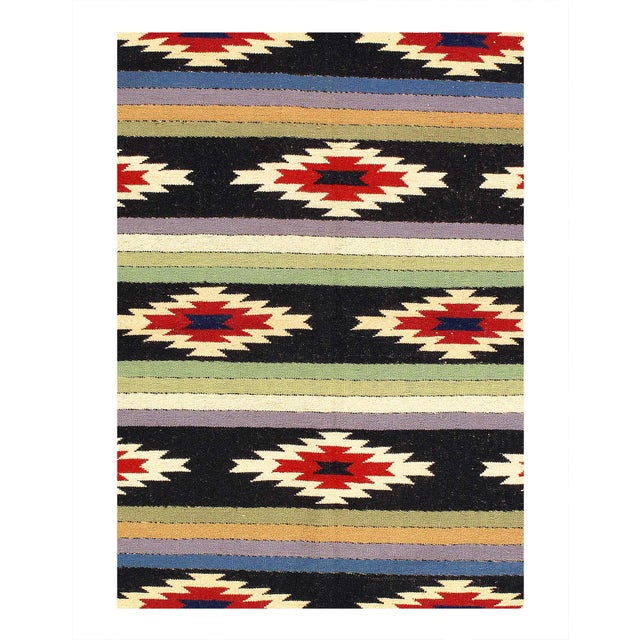Kilim, a word of Turkish origin, denotes a pileless textile of many uses produced by one of several flatweaving techniques...