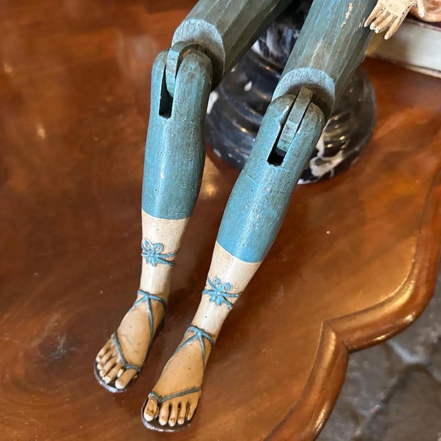 A charming vintage mannequin from the 1950s, beautifully crafted figure is a perfect blend of functionality and folk art,...