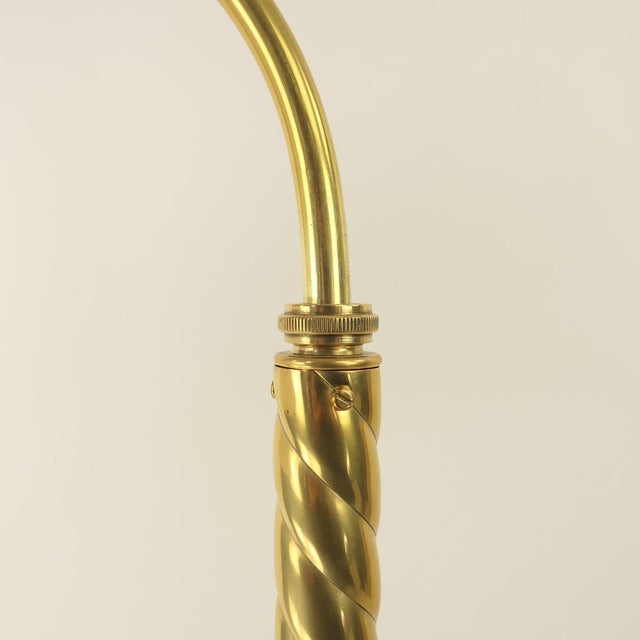 Massive brass floor lamp with opal glass shade the lamp gives a cosy, non-dazzling light. polished surface. the lamp has...