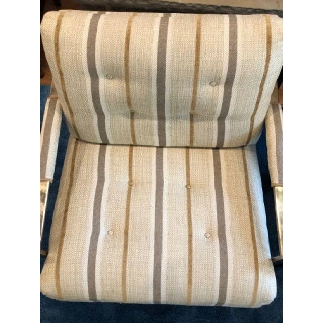 Vintage flat bar lounge chairs in brass finish. Button tufted seat and back