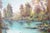 This serene oil on canvas landscape painting captures a peaceful river scene surrounded by softly glowing trees in full...