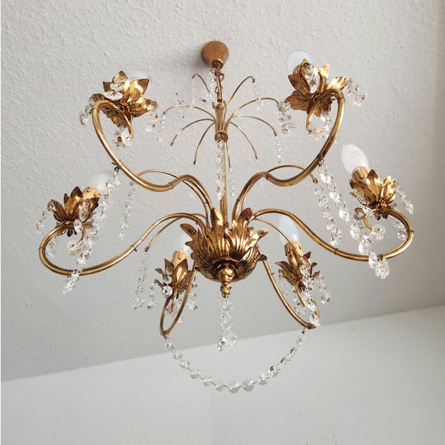 Hollywood Regency Crystal Cascade Waterfall Decorated Gilded Brass 6-Light Chandelier with Lead Crystal in Brass is a true...