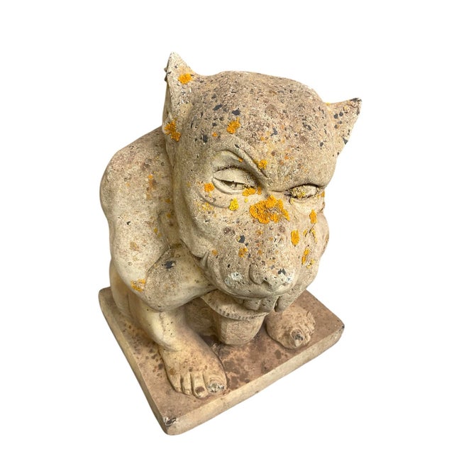 Bring a touch of whimsical, gothic charm to your outdoor space with this vintage cast stone gargoyle statue. Masterfully...