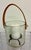 Glass candleholder or ice bucket with leather handle. 6" high x 6" diameter. Includes glass jar with leather handle, black...