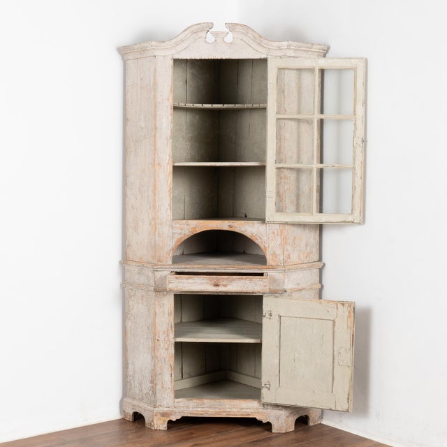 This lovely pine corner cabinet has clean lines with an attractive crown and was crafted in the early 1800's. It is built...