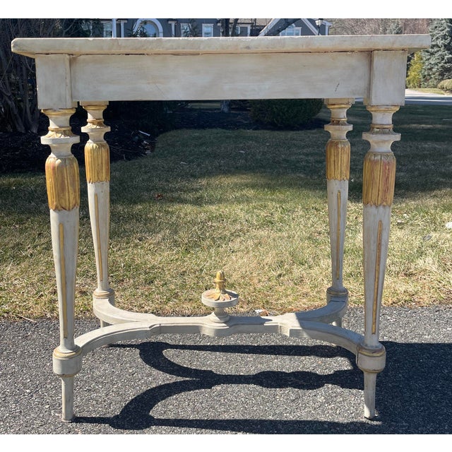 Late 19th-century antique Swedish or French Neoclassical style console table with hand-painted faux marble top. Original...