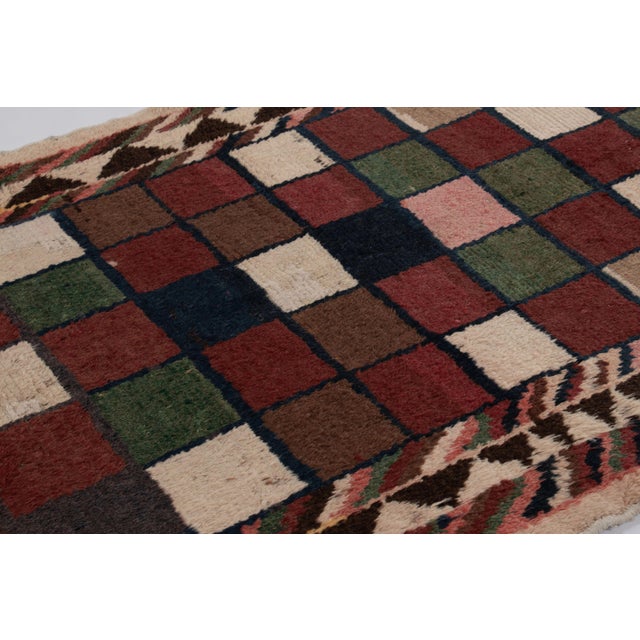 Hand-knotted in high-pile wool in Sweden circa 1960-1970, this 5x8 vintage Swedish Rya rug is a bold new addition to Rug &...