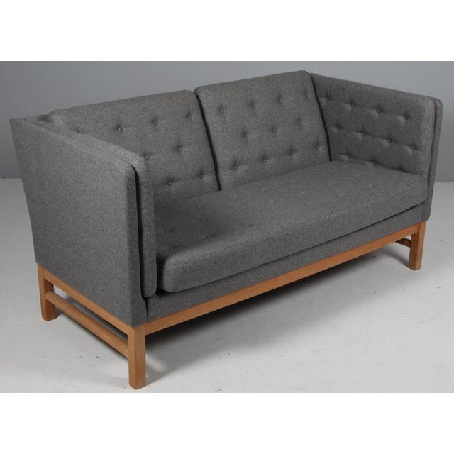 Erik Jørgensen two-seat sofa new upholstered with grey Magrethe wool from Nevotex. Frame of oak. Model EJ 315/2, made by...