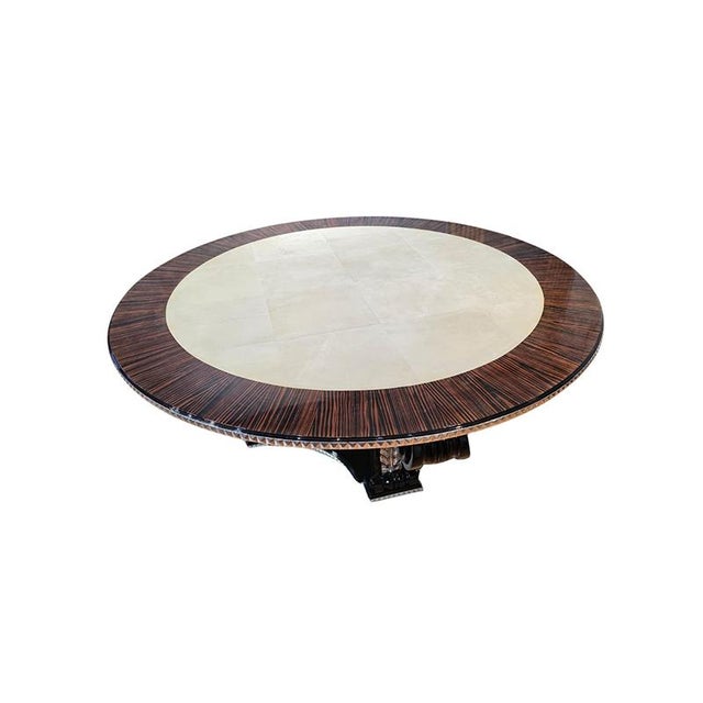 A large dining table with a striking presence, crafted from wood and parchment. The circular top, 200 cm in diameter,...