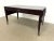 Campaign-style writing desk designed by Eric Brand for the Mulholland Brothers Home Collection. Features a dark wood...