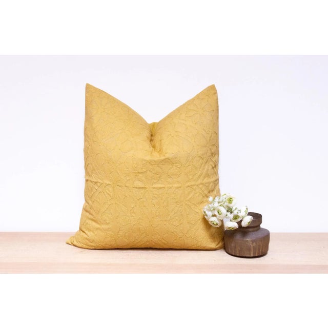 This vibrant decorative pillow cover features beautiful array of patterns, with hand crafted appliqué cut work, giving it...