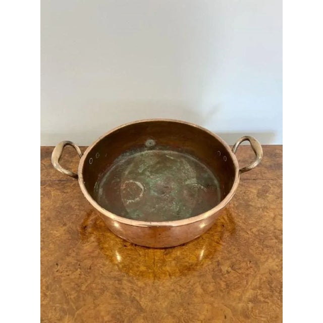 Large quality antique George III copper pan having a quality large antique George III copper pan with shaped handles to...