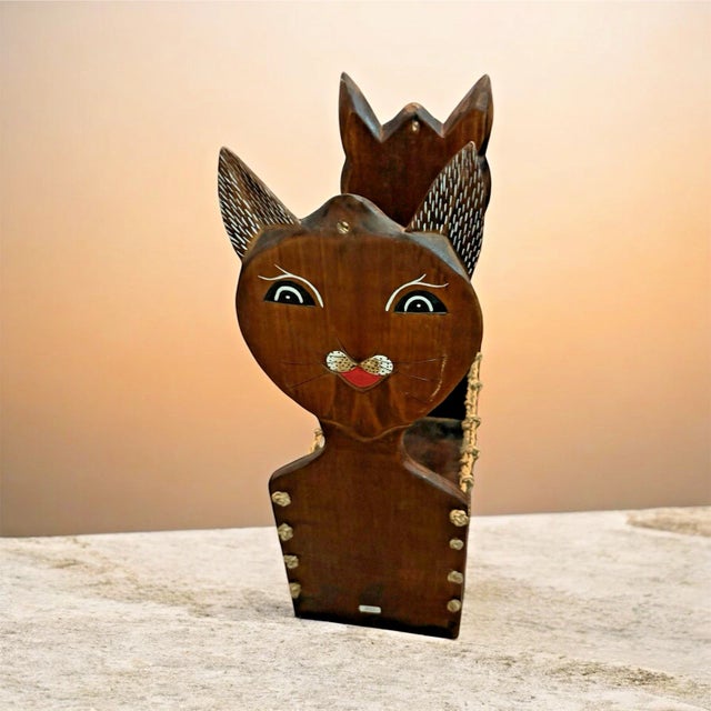 Bring charm and character to your home with this Vintage Hand‑Carved Wooden & Climbing Rope Cat Magazine Rack — a unique...