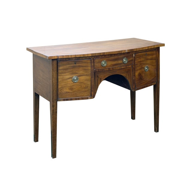 Elevate your home with this stunning antique Federal-style mahogany sideboard, a masterclass in classic craftsmanship that...