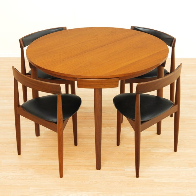 An iconic Danish modern dining set designed by Hans Olsen. This sought-after “Roundette” table and chairs was produced in...