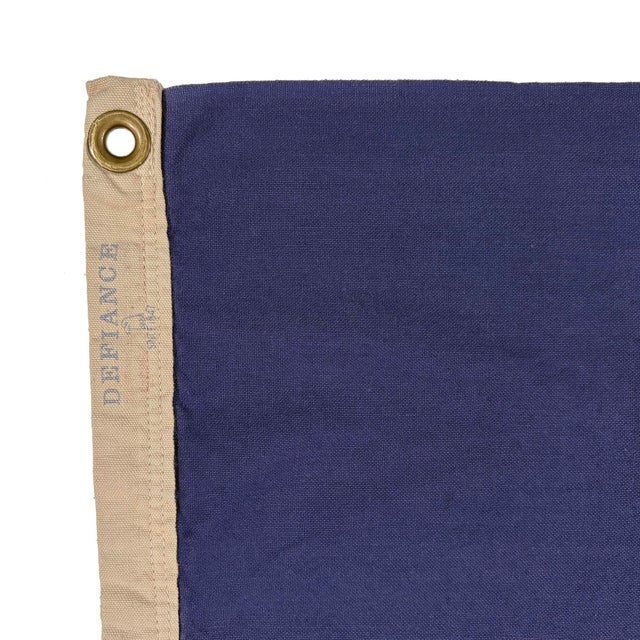 This vintage Pennsylvania flag is from a cotton cloth faded blue. Please note misshapenness, discoloration and other wear...