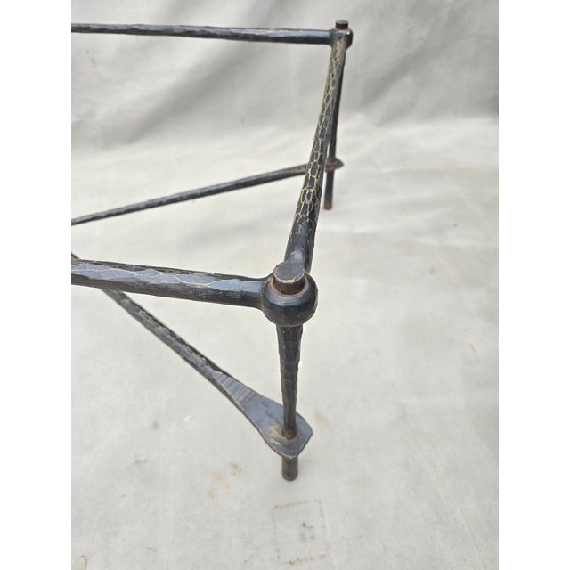This is a contemporary hammered iron table in the style of Giacometti. Probably from the late 20th century. When cleaning...